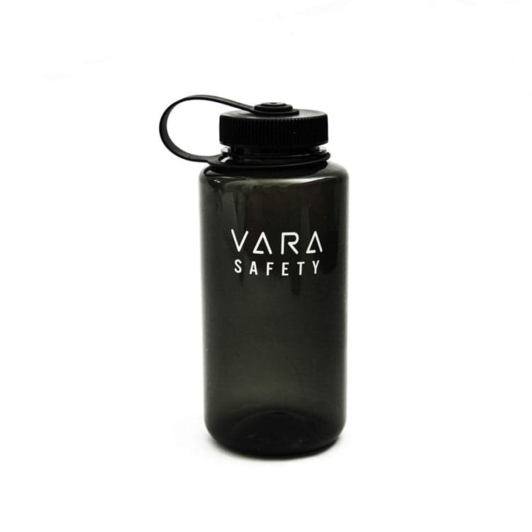 The Vara Safety 32 ounce water bottle: smoke-grey with a black cap and handle and the Vara Safety wordmark